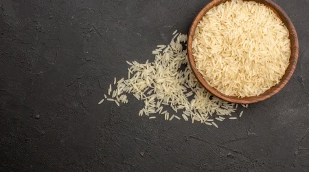 top-view-raw-rice-inside-brown-plate-dark-grey-surface_converted
